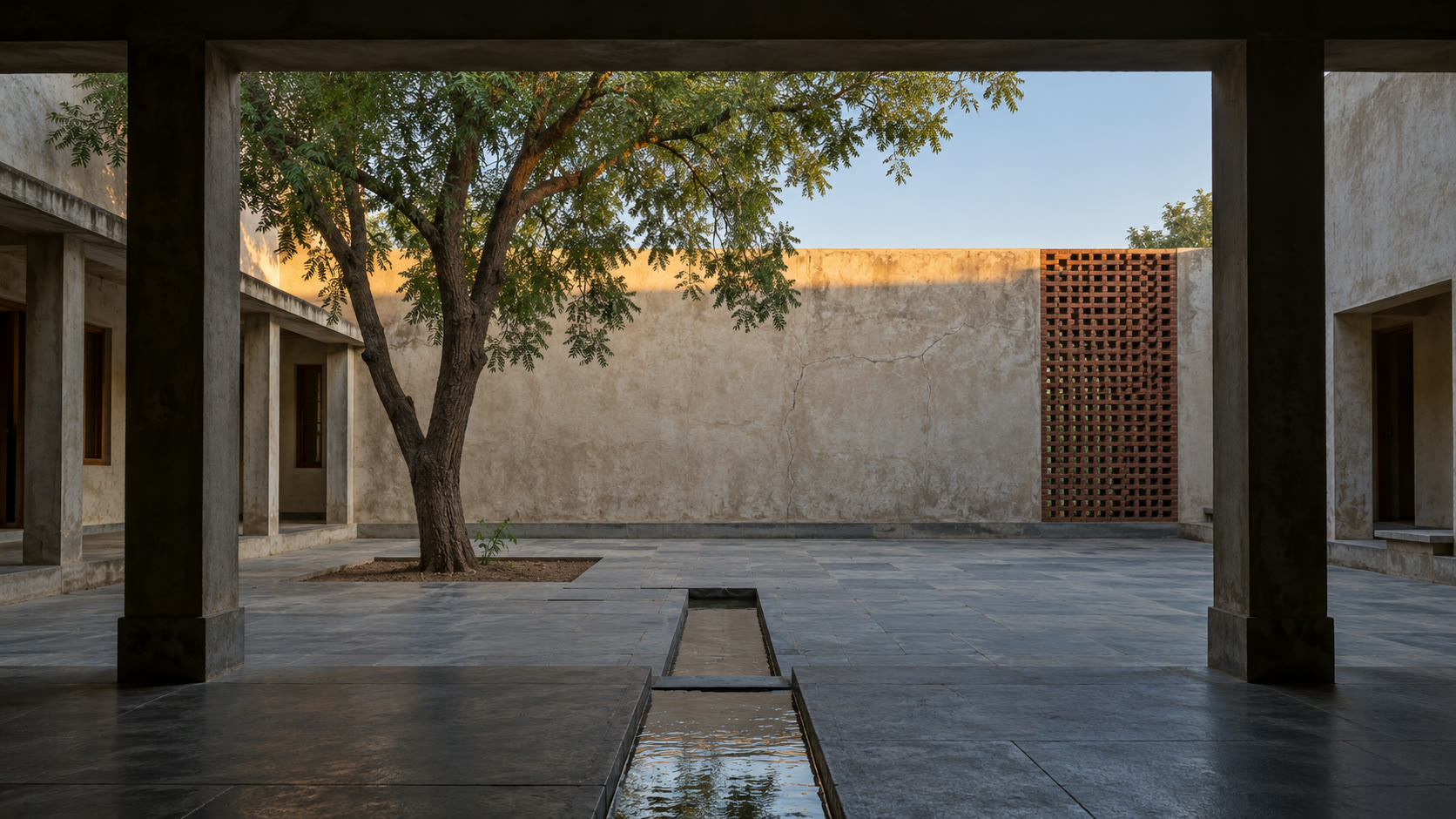 The internal lane at early morning: brick and lime walls, deep-set windows and teak doors.
